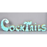 A Mexican Industrial Pub Art sign, in the form of the word 'Cocktails', in turquoise and yellow,