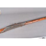 A 19th Century Indian Matchlock Musket, with a six band barrel, with flared and engraved muzzle,
