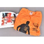 Dennis Bergkamp Testimonial, an orange T shirt printed Bergkamp 10 on back with testimonial