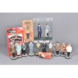 A Vintage 'The Smoking Statesman' figure, in box, together with smaller novelty example, plus a