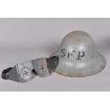 A WWII British Civil Defence Zuckermann helmet, marked SFP for Fire Watcher, by CC&S dated 1941,