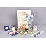 An assortment of Churchill related items, to include brass door knocker, badges, coins, cufflinks,