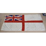 A large British Royal Navy White ensign flag, from HMS Eagle 1964-66, with smoke marks to the main