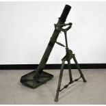 A blank firing mortar launcher, the launcher painted in traditional black and green camouflage