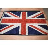 A WWI Royal Flying Corps (RFC) Union Flag, dated 1914, marked with a broad arrow, approx. 159cm x
