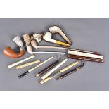 A selection of Meerschaum and other smoking items, comprising pipes, bone, wooden and other cheroots