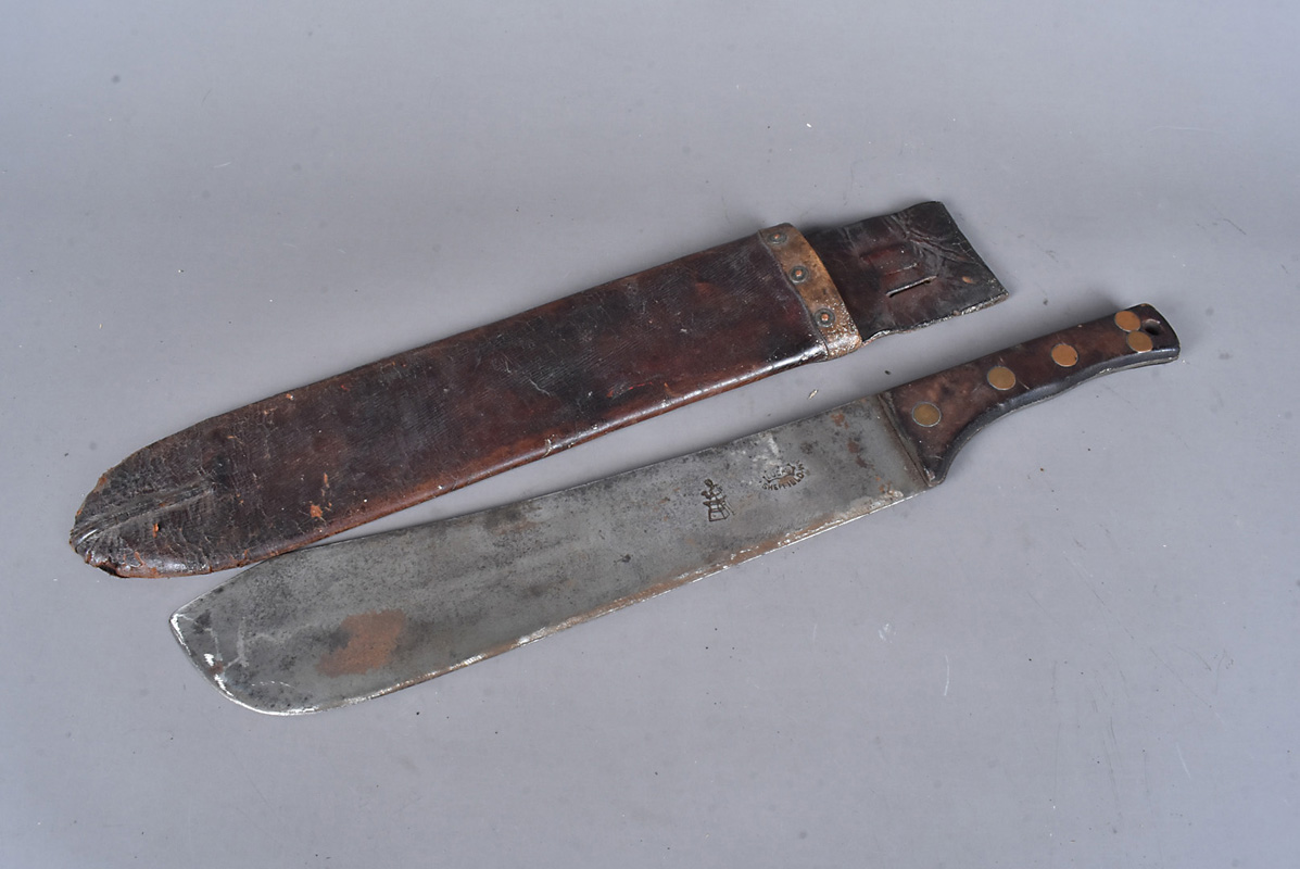 A WWI 1915 machete by Lucas of Sheffield, with maker's stamps to the 34.5cm long blade, wooden