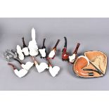 An assortment of smoking pipes, to include modern Meerschums, mainly in the forms of Middle