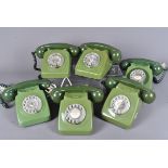 A group of six vintage green coloured rotary telephones, all complete with hand sets (6)