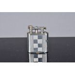 A Sarastro German silver manufactured petrol pocket lighter, with liftarm, silver jacket with