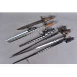 A collection of world bayonets, to include a British 56, A Canadian Ross, SKS, Mosin Nagants, a