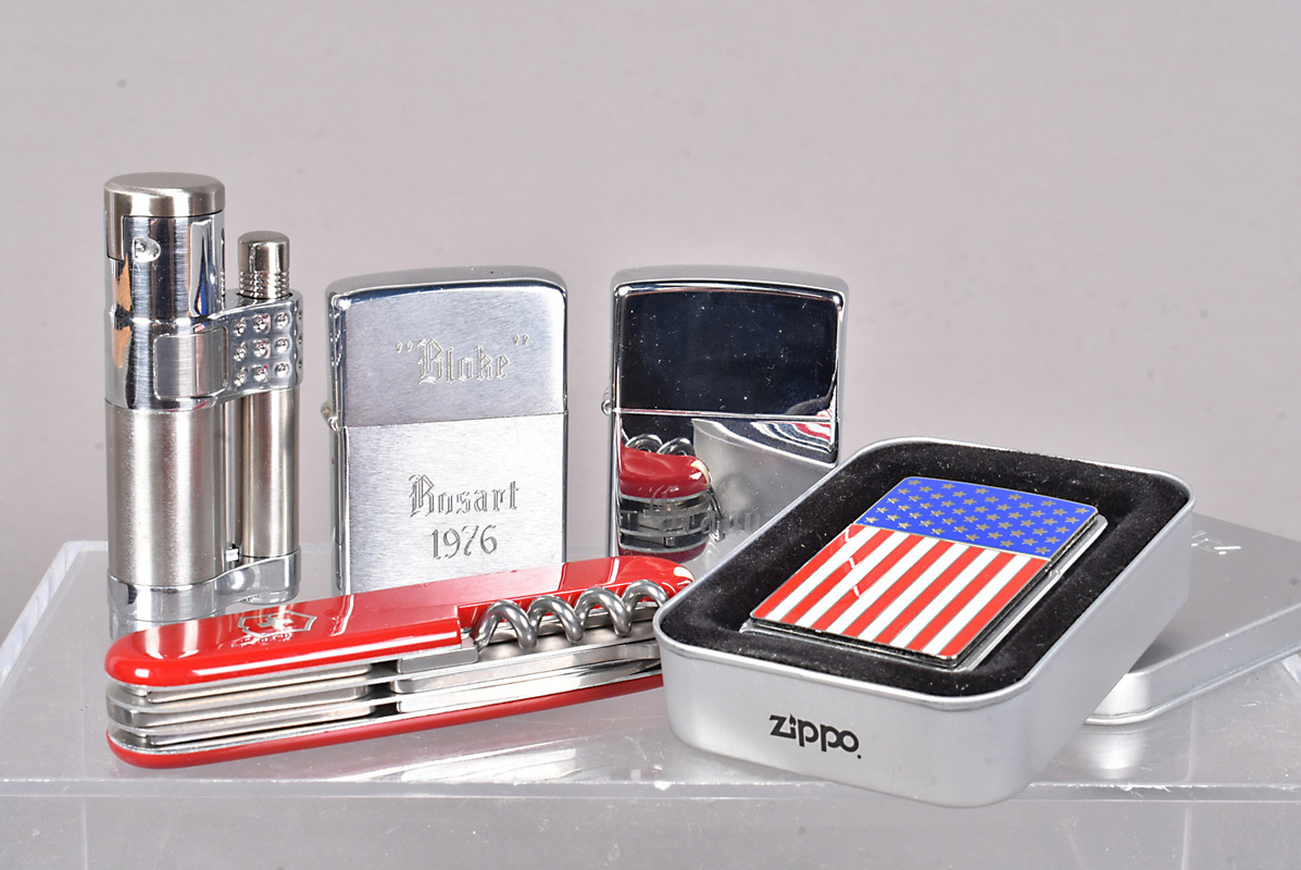 A 1975 brushed chrome Zippo lighter, with the engraving ''Bloke, Bosart 1976'' to the front, plus