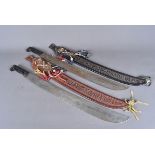 Two Guatemalan machetes by El Mosquito, 60cm long blades, both with leather sheaths, with decorative