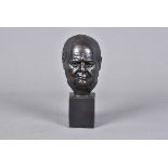 A small bronze figure of Winston Churchill by Heyfron, the bronze head with maker's name to