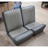 A pair of Vintage Restall Type II car seats, in dark and light grey, complete with brackets (4)