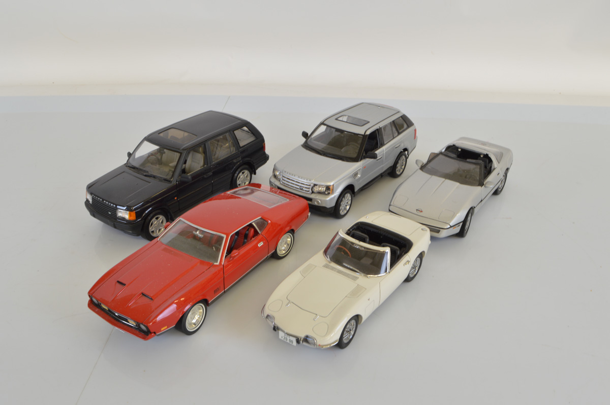 Five James Bond 1:18 scale models, including Autoart Toyota 2000GT, Ertl Chevrolet Corvette, Ford