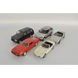 Five James Bond 1:18 scale models, including Autoart Toyota 2000GT, Ertl Chevrolet Corvette, Ford