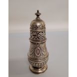 A Edward VII silver sugar sifter, Queen Anne style, embossed swag design, London 1902, by Goldsmiths