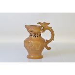 A 19th century stoneware puzzle jug, with eagle adornment to handle, no makers mark to base. 22cm