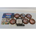 A mixed lot of James Bond 007 items including, Goldeneye phone cards, a set of Franklin Mint limited