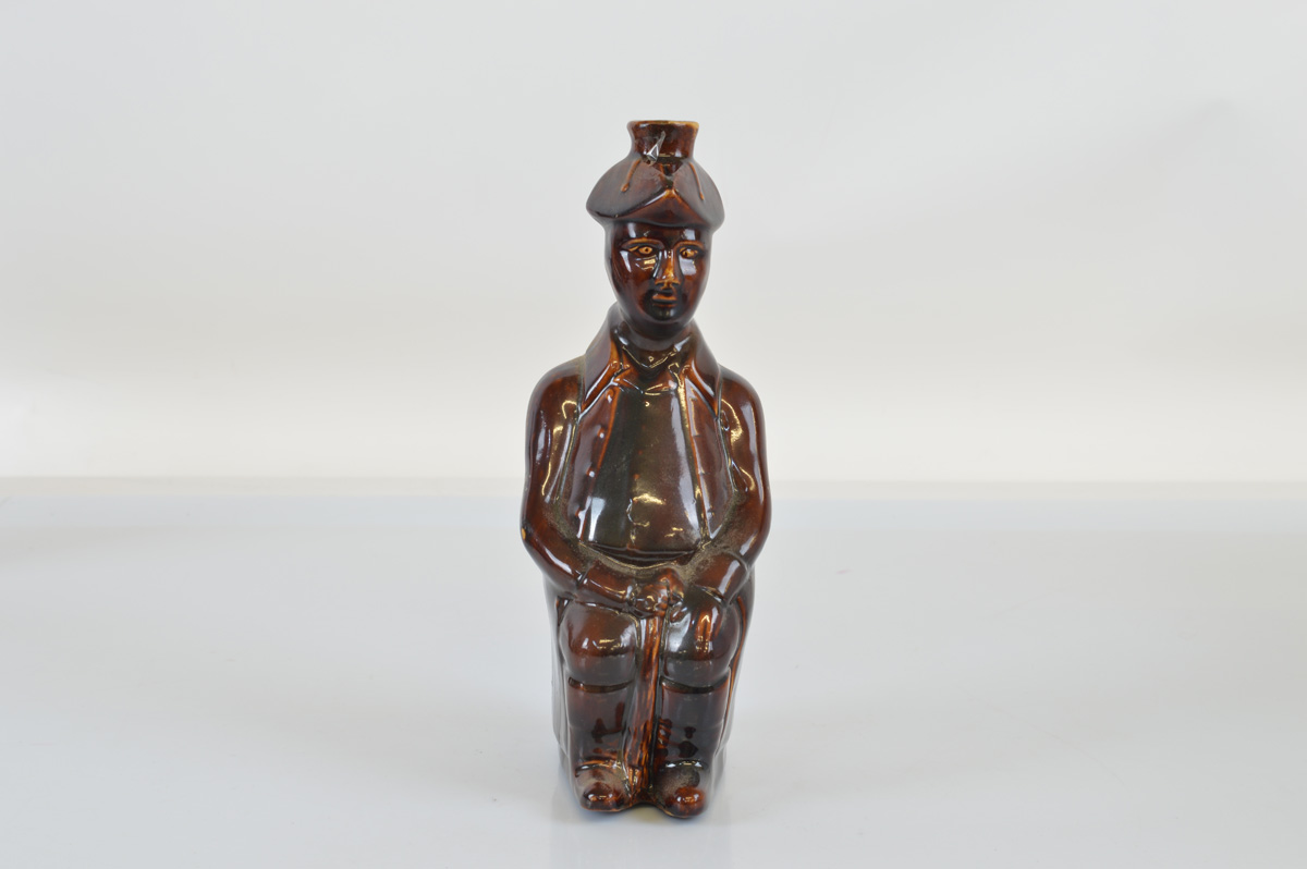 A treacle glazed figural flask, gentleman in tricorn hat, impressed Edward Whyatt of Bondary