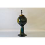 A large studio art glass sculpture, of globe form with flared base, standing 73cm tall.