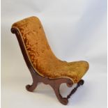 A mahogany framed gout stool or child's chair, having mustard coloured velvet and buttoned