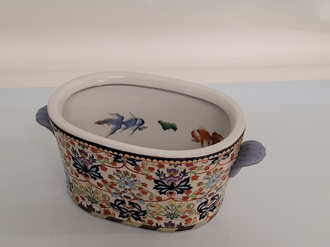 A contemporary porcelain Chinese jardinière, oval twin handled with floral decoration, fish design