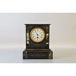 A late 19th century slate cased mantle clock, with white enamel dial, Roman numerals, with two