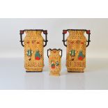 A pair of Art Deco twin handled plaster vases, 25cm tall together with a smaller example 14.5cm tall