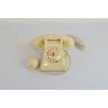 A mid 20th Century French rotary dial telephone, with "Mother-In-Law" ear piece extension