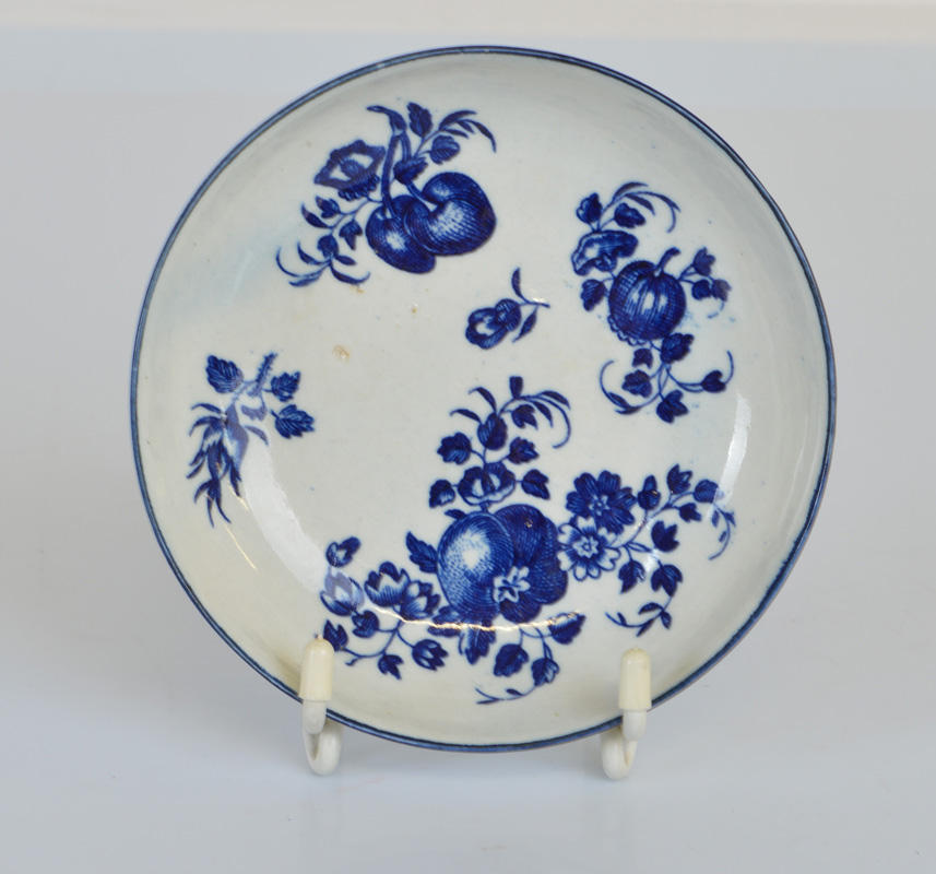 A first period Worcester blue and white circular saucer dish, with fruit and sprig pattern,