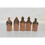 Five Belper & Denby Bournes Potteries figural flasks, including Lord John Russell, Daniel O