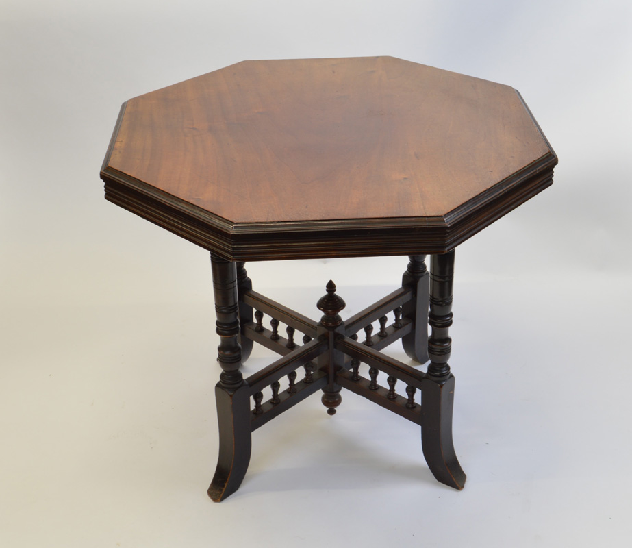 A mahogany octagonal occasional table, having four turned legs on splayed feet with baluster x