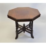 A mahogany octagonal occasional table, having four turned legs on splayed feet with baluster x