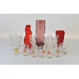 A collection of glassware, including three Whitefriars style vases, two red examples one of textured