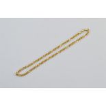 An 18ct gold figaro link chain, stamped 18ct to clasps. 40.5cm long. 13.0g