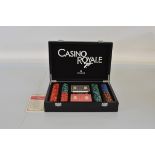 A Cartamundi Casino Royale poker set, in fitted carry case.