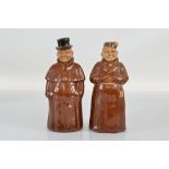 Two figural flasks, having removable head lids, one a monk, impressed 8300 to base, 23.5cm high, the