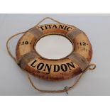 A novelty lifebuoy Titanic style mirror, circular shape with rope and cloth design, marked Titanic