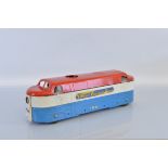 A scarce unboxed Tri-ang Pressed Steel 'Diesel Electric' Locomotive model in red, blue and white,