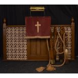 A cast iron and painted oak Preacher's lectern and screen, with repeating floral and scroll grill