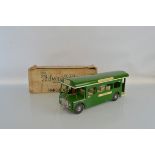 A hard to find boxed Tri-ang Pressed Steel TM3910 Single Decker Bus model in 'Green Line' livery,