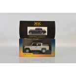 Two 1:18 scale diecast models, Land Rover Defender 110 and limited edition KK Scale Mercedes 220S