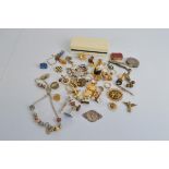 A collection of costume jewellery, including silver gilt gem set cluster ring, gold shell buckle