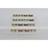 16 boxed Tri-ang 'Minix' miniature 'OO' gauge plastic cars including six Hillman Minx, four Austin