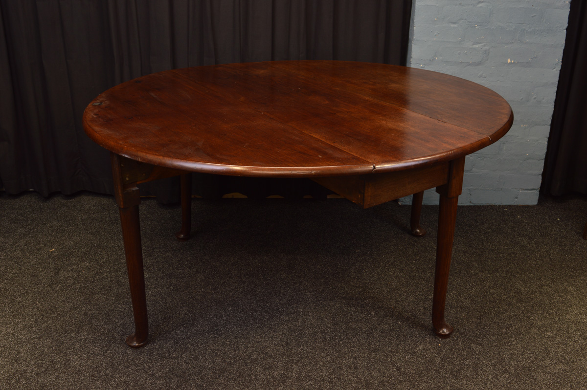 A George III mahogany double gate leg table, on pad feet, with brass plaque inscribed "WA. Howell