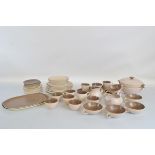 A Poole Pottery dinner service, two tone pink and brown, including tureens, soup bowls, cups,