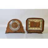 Two oak cased mantle clocks, both with brass movements.