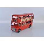 An unboxed Tri-ang TM3905 Pressed Steel Routemaster Bus model in red, approximately 58cm long. A